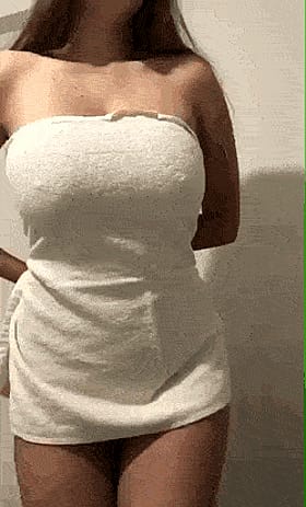 This babe's gotta hand on her own big tits and loves she squeezin' 'em real good'