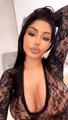 Horny bimbo flaunting massive tits in lace'
