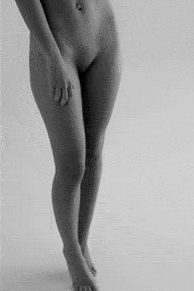 Damn, that gorgeous brunette is naked and her huge tits are hypnotic!'