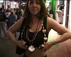 Busty Brunette Flashes Big Tits at Mardi Gras'