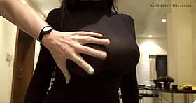 Feeling up her huge juggs through that clingy top'