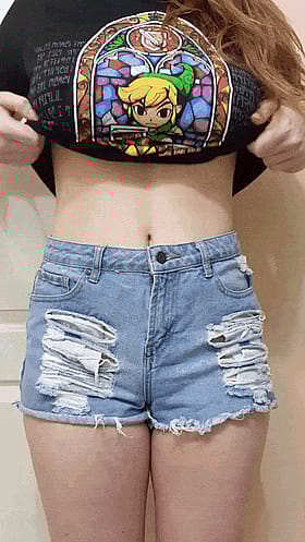 Peek-a-boo tits flash from under that tight tee'