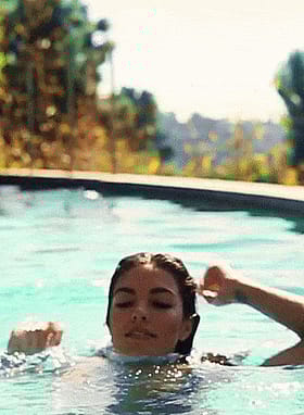 Sultry brunette rises dripping wet and ready for action'