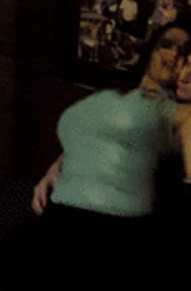 Sexy green-top babe flaunts her juicy melons'
