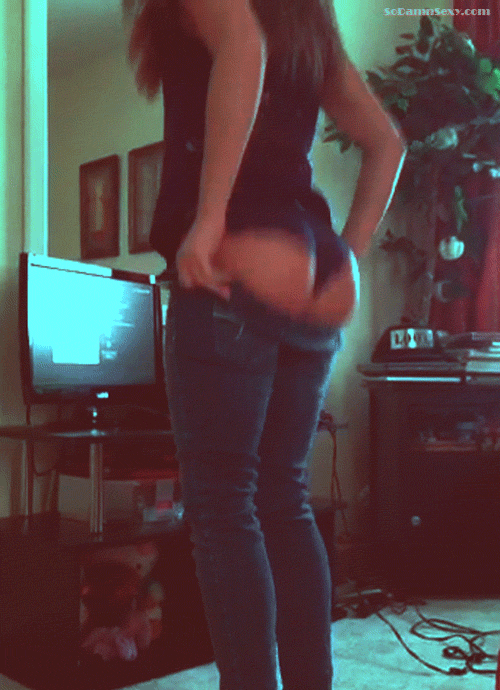 Tight jeans struggle to contain that plump peach picture 1 of 1