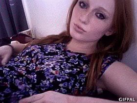Fiery ginger babe flaunts her juicy melons in hot gif'