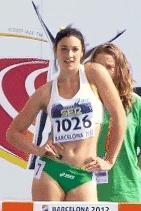 Hot athlete stretching before the big race'