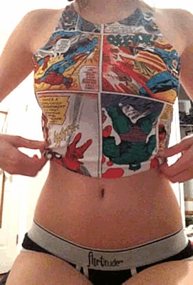 Busty Nerdy Babe Shows Off Her Goods'